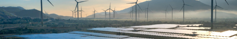 A picture of a wind farm and solar panels on a renewable energy project