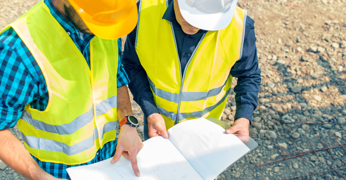 A Project Manager in a high-vis vest