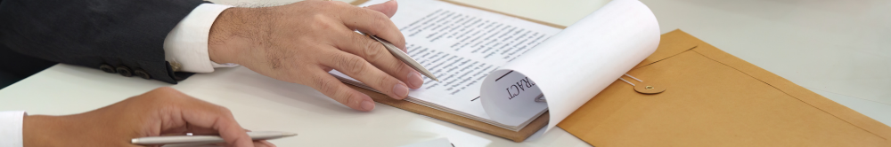 Legal professionals signing documents