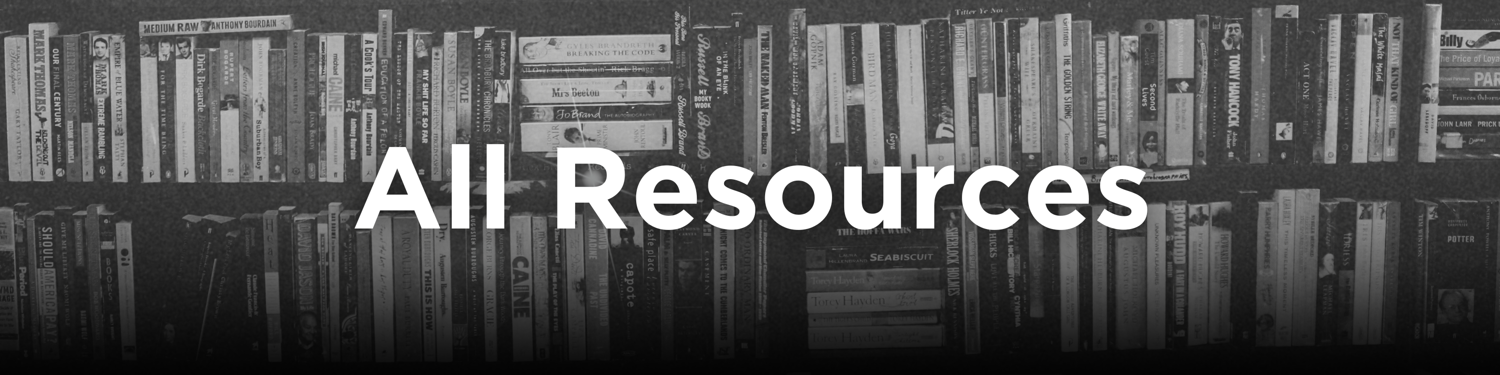 A bookshelf full of books in black and white to show the amount of resources that we have