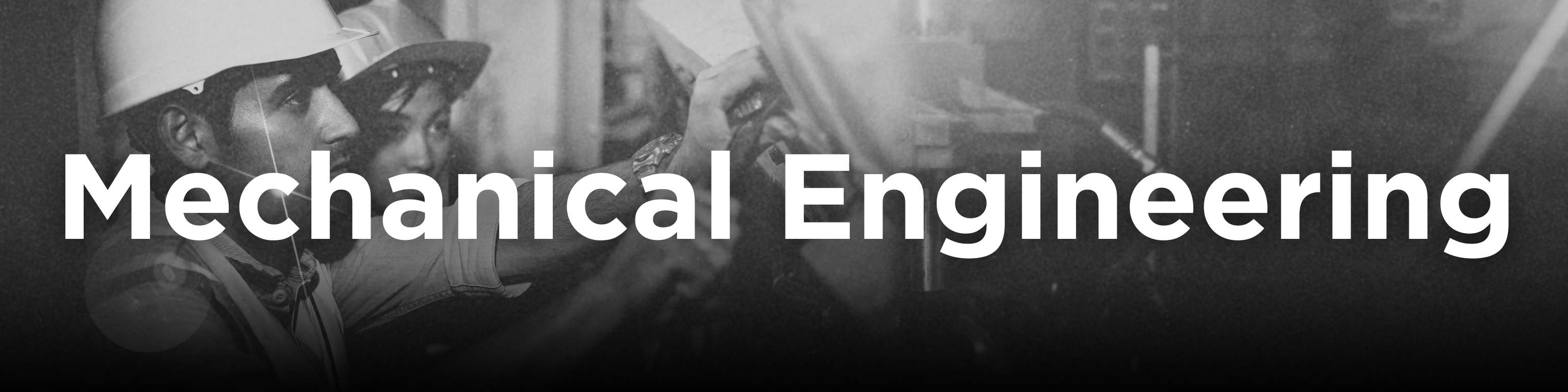 A mechanical engineer in a white helmet